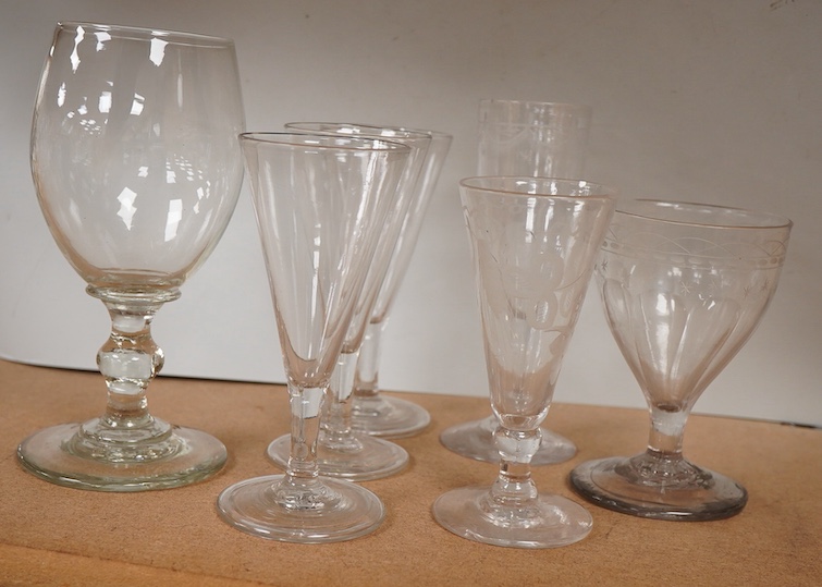 A a set of three early 19th century ale glasses with folded feet, together with two additional engraved ale glasses, a knopped rummer and another, tallest 18cm